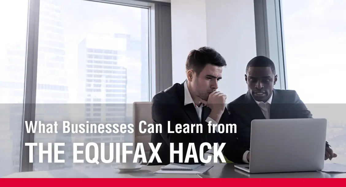 What businesses can learn from the Equifax hack text overlaid on image of two businessmen looking at a computer with concern