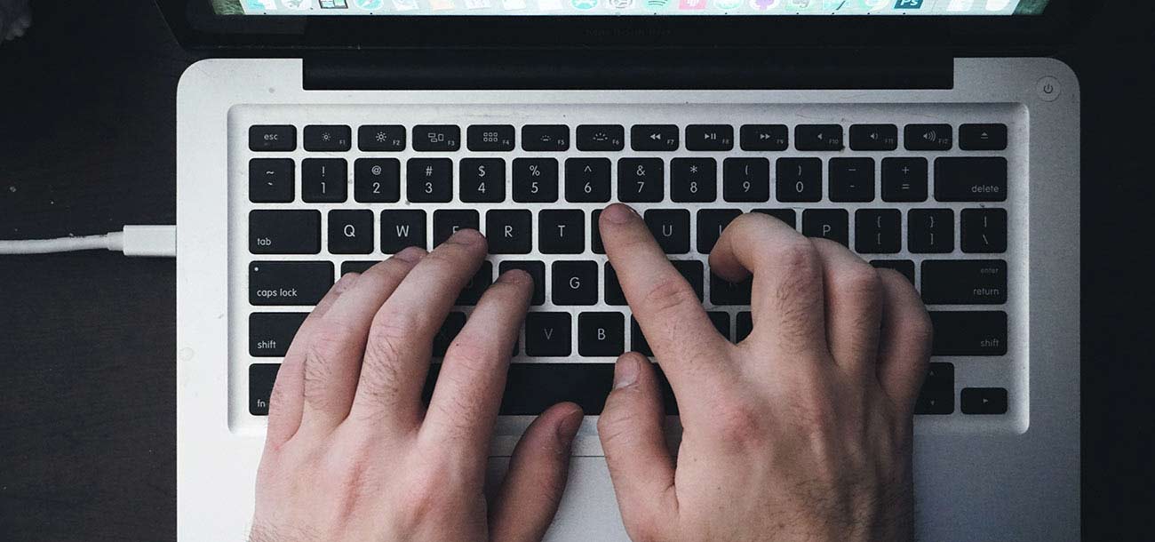 Person-typing-on-laptop-keyboard